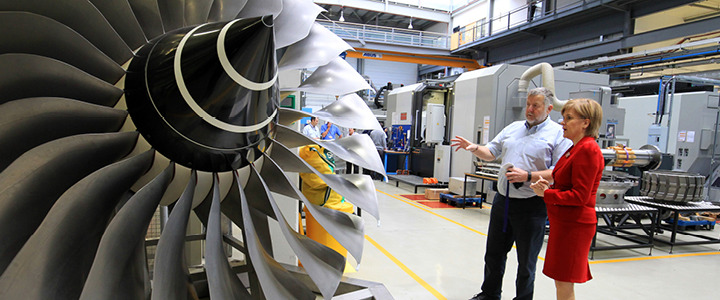 First Minister visiting Sheffield Advanced Manufacturing Research Centre next to a massive turbine fan