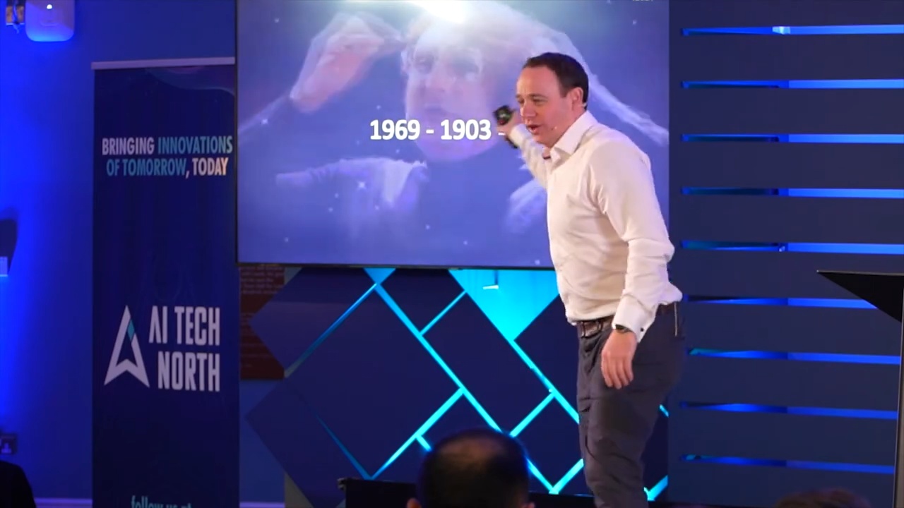 Data visualisation slide behind Jamie Hinton at AI Leaders Summit