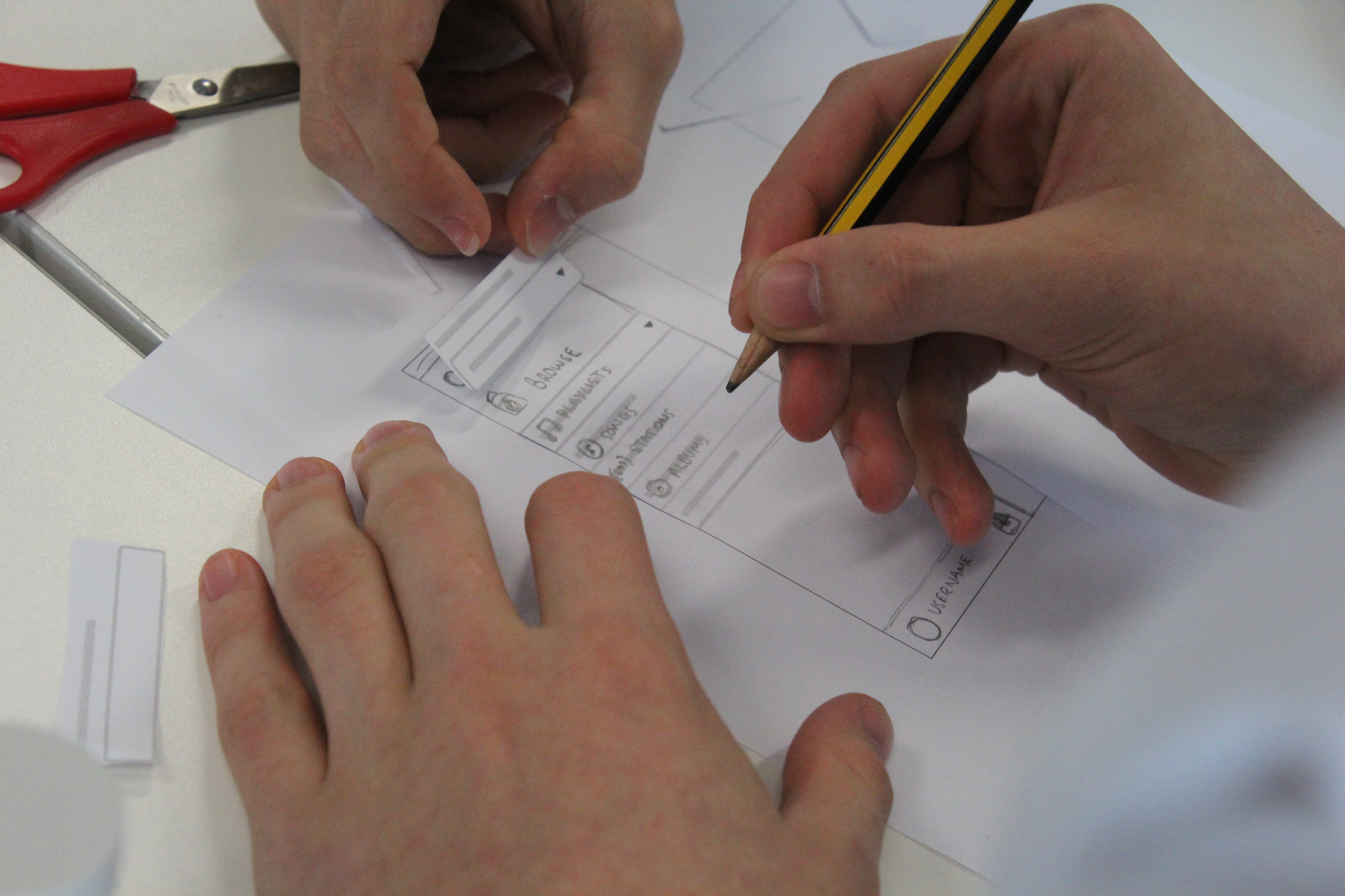 Razor team collaborating around a whiteboard